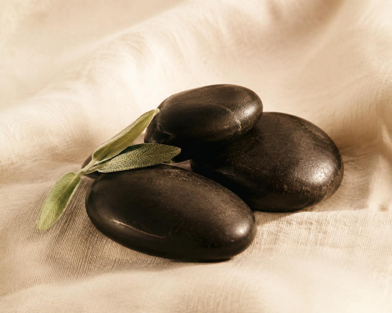 Warm hot stones with sage leaf